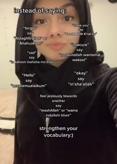 a woman wearing a black hoodie with words written on the side of her face