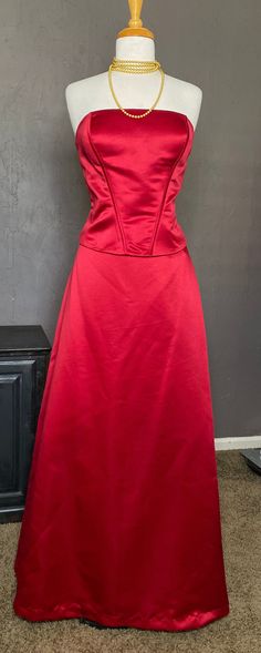 1990s-00's Formal 2 piece Strapless Gown set from Bill Levkoff, size 16 tag (please see measurements for best fit). Crisp Red Thick Satin Polyester fabric, lined in Red soft lightweight Acetate fabric. Fabulous Gown when worn together, or we love a White button down knotted at the waist paired with the skirt, a Graphic T, or Wearing the Bustier top with Jeans, or Tux Pants. Top has Ribbon Corset Lacing at the back- it is Decorative. Supportive Boning, Side zipper with hook and eye at top + Botto Fitted Satin Skirt For Prom, Evening Holiday Fitted Skirt, Formal Fitted Red Maxi Skirt, Fitted Satin Maxi Skirt, Red Satin Skirt For Formal Occasions, Fitted Maxi Skirt For Evening Prom Season, Fitted Maxi Skirt For Evening Prom, Red Satin Formal Skirt, Fitted Maxi Skirt For Prom Season Evening