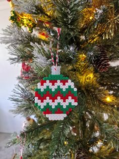 a christmas ornament hanging from the top of a tree