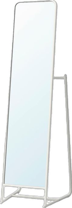 a white standing mirror on top of a stand