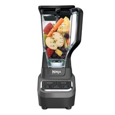 a blender filled with lots of different types of fruit