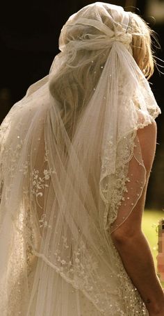 the back of a woman's head wearing a veil