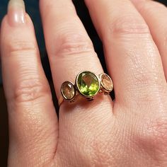 Beautiful Settings On This Multi Gem Ring. Peridot Center With 2 Citrine Accents, Not Only That...There Are Tiny Stones Set Within The Scroll Setting On The Sides Of Each Stone. *See Photos 2 On The Peridot And 2 On Each Of The Citrine Settings. Stamped 10k With The Makers Mark..See Photos To View All Of The Details. I Purchased This Ring Many Years Ago, It Has The Birthstones For My Children. Sadly I Rarely Wear It These Days. The Band Shows Some Wear Which Doesn't Distract From The Beauty Of This Ring. Some Inclusions In The Gems However, They're Not Visible To The Naked Eye Without Magnification. Photos Shown Magnified* In Order To Show Details. Size 7 1/2 As Shown On My Sizer. Please Multi Gem Ring, Beautiful Settings, Gem Ring, 2 On, Stone Settings, 10k Gold, Womens Jewelry Rings, Makers Mark, Citrine