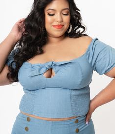 Fresh femininity, dames! This sultry plus size top from Unique Vintage is crafted in a sturdy woven fabric that radiates rockabilly vibes in chambray blue. The Turner Top boasts a self tie bow for added retro flair while the stunning off the shoulder and Bardot sleeves lends eye-catching detail to your posing. Outfitted with a smocked back and elastic cuffs for a flattering fit!Available in sizes XS-5X while supplies last. Vintage Plus Size, Tie Bow, Plus Size Top, Woven Top, Model Pictures, Chambray, Unique Vintage, Woven Fabric, Strapless Top