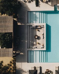 an aerial view of a swimming pool and patio