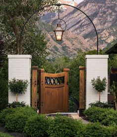 an entrance to a home with mountains in the background