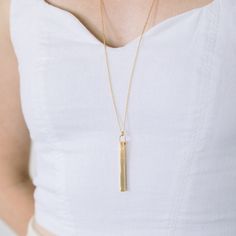 A fun version of the traditional bar necklace, the Coordinate Vertical Bar Necklace will help you keep a favorite place close to your heart. The vertical bar is custom engraved with your choice of coordinates, making it the perfect gift for graduations, weddings, engagements, and more. Available in 14k gold plated, rhodium plated or 14k rose gold plated brass Bar size: 2" by 3/16" 30" cable chain with 2" extender Lobster claw closure With engraving this item is FINAL SALE SKU: BYN1100 Minimalist Rectangular Bar Necklace As Personalized Gift, Minimalist Rectangular Bar Necklace For Personalized Gift, Minimalist Rectangular Pendant Bar Necklace For Personalized Gift, Traditional Bar, Vertical Bar Necklace, Brass Bar, Silver Bar Necklace, Vertical Bar, Pretty Necklace