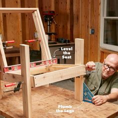 a man working on a wooden bench with measurements and instructions for the seat frame to be built