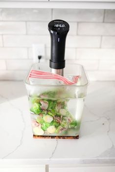 a blender filled with vegetables on top of a counter