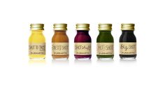 six different types of juices in glass bottles