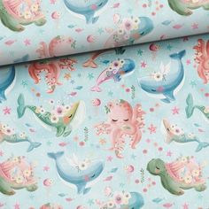 a blue wallpaper with sea animals and flowers