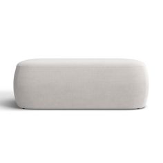 a white couch sitting on top of a white floor