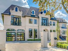 a large white house with lots of windows