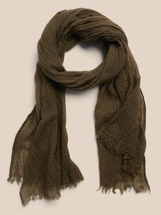 Soft and warm, this lightweight scarf is crafted from fine wool, specially woven for a gauzy finish with a crinkled texture, and rustic, raw edges.  Layer it expertly on your traveler, whether remote or routine.  Length: 70" (177. 8cm) Width: 30" (76 Wool Knit Scarf, Dark Acadamia, Travel Scarf, Big Scarf, Big Sweaters, Fairy Core, Lightweight Scarf, Wool Scarf, Face Coverings