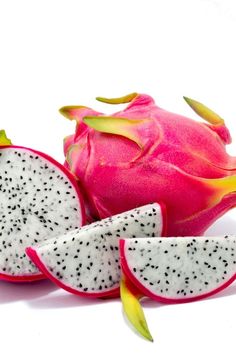 a dragon fruit cut in half on a white background