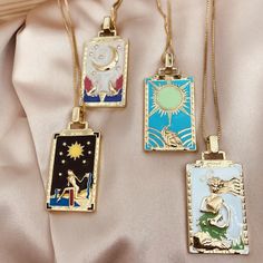 18k gold plated, stainless steel chain Tarnish resistant Features AAA cubic zirconia crystals 11 tarot card pendants