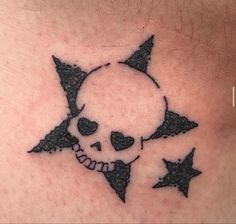 a skull and stars tattoo on the chest