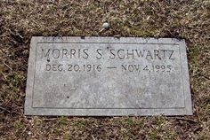 a headstone is placed in the grass on top of some dead grass, which reads doris s schwarzwarttz dec 20, 1915 - november 4, 1939