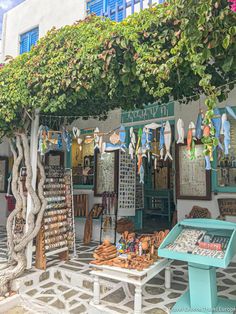 an outdoor market with lots of items on display