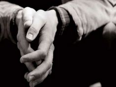 two people holding hands in the middle of each other's arms, with one person reaching out