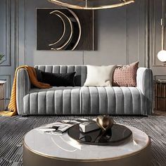 a modern living room with grey couches and gold accents