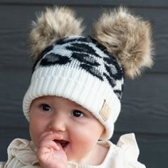 Make a statement with this adorable CC Double Pom Kid Leopard Beanie! This luxurious and soft beanie is designed with top-notch C.C. Branding and Quality, and features two fluffy faux fur poms for extra cuteness. Plus, just a bit of brushing and hair-dryering and you'll have your pint-sized fashionista fluff-ready in no time- wowza! Product Features: Authentic C.C  Branding & Quality Imported Faux Fur Poms After receiving the hat use a hair dryer on cold air and brush with small-tooth comb to ma Leopard Beanie, Winter Baby Boy, Toddler Beanie, Baby Leopard, Kids Beanies, Bobble Hats, Baby Cap, Knit Cap, Cute Hats