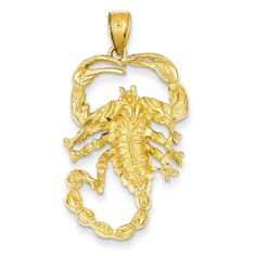 a gold scorpion pendant on a white background