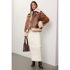 Brown faux leather (100% Polyester). Jacket. Long sleeves. Collar. Front zipper closure. 25" from shoulder to hemline. Imported. Spring Workwear Leather Jacket With Faux Fur Trim, Spring Leather Jacket With Faux Fur Trim, Brown Leather Jacket With Zip Cuffs For Work, Chic Leather Jacket With Zip Cuffs And Long Sleeve, Fall Leather Jacket With Zipper For Work, Chic Long Sleeve Leather Jacket With Zip Cuffs, Chic Biker Jacket With Faux Fur Trim For Work, Chic Biker Jacket With Faux Fur Trim, Fall Workwear Outerwear With Faux Fur Lining