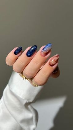 Aistė Haas on Instagram: "🌌🌒✨ bringing the beauty of the Universe, Jupiter and Europa to my nails ✨🛰️  Nail art celebrating @NASA @NASASolarSystem ‘s  mission to explore Jupiter’s icy moon, Europa, searching for clues about its potential to harbor life. Europa Clipper’s mission will bring us closer to answering one of humanity’s biggest questions: Are we alone in the universe?   How exciting is that?!!   _____ #RunwayToJupiter #galaxynails #bluenails #brownnails #marblenails #gradientnails  #glitternails #sparklynails #nailinspo #nails cute nails , almond nails , nail art tutorial," Jupiter Nails, Neptune Nails, Nasa Nails, Universe Nails, Galaxy Nails, Gradient Nails, Sparkly Nails, Brown Nails, Marble Nails