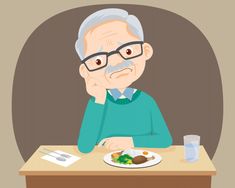 an old man sitting at a table with his plate of food in front of him