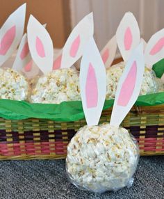 some bunny ears made out of rice sitting in a basket next to other food items