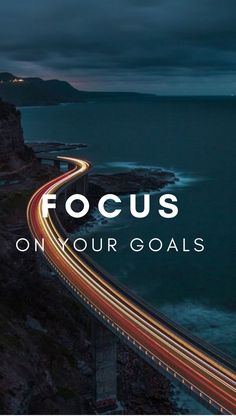 a road with the words focus on your goals over it and an image of a highway going