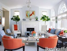 a living room filled with furniture and lots of orange numbers on the wall above it