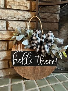 a wooden sign that says oh hello there with a bow on it and some leaves