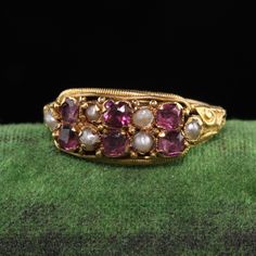 Beautiful Antique Victorian 14K Yellow Gold English Ruby and Pearl Ring. This beautiful ring is fully hallmarked inside the band and is in great condition. Item #R1037 Metal: 15K Yellow Gold Weight: 2.1 Grams Ruby: Approximately .50 cts Ring Size: 5 1/4 Measurements: Top measures 7.66 mm wide and band measures 2 mm wide. Measurement from finger to top of ring: 2.75 mm Layaway: For your convenience, we will be happy to provide layaway payment options. Please contact us to work out a layaway plan Ruby And Pearl Ring, Victorian Rings Vintage, Garnet And Pearl, Ruby And Pearl, Antique Rings Victorian, Sunburst Ring, Antique Gold Rings, Antique Jewelry Rings, Italy Jewelry