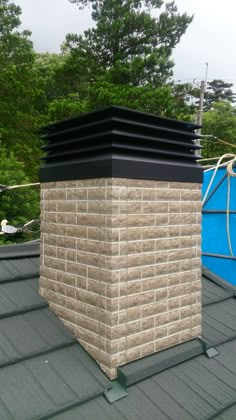 a brick chimney on top of a roof