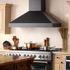 a stove top oven sitting inside of a kitchen