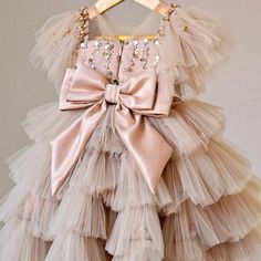 Prepare to shine in this Sequin Princess Dress Cake Dress with a silk Ribbon Bow in Beige Pink. The dress boasts a gorgeous beige-blush pink hue, embellished with shimmering sequins.Ideal for any festive event, it will make your little one feel like royalty. This dress embodies the ultimate blend of sophistication and allure, making it the perfect choice for flower girls and special occasions. Princess Dress Cake, Cake Dress, Vestidos Color Rosa, Girls Long Dresses, Puffy Dresses, Dress Cake, Tulle Tutu, Girl Princess Dress, Childrens Dress