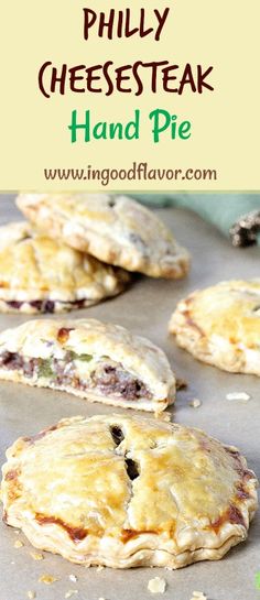 homemade cheesesteak hand pies on a baking sheet with the title overlay