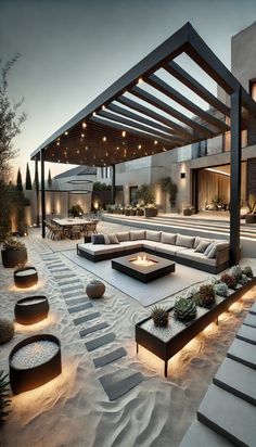 an outdoor living area with couches, tables and lights on the side of it