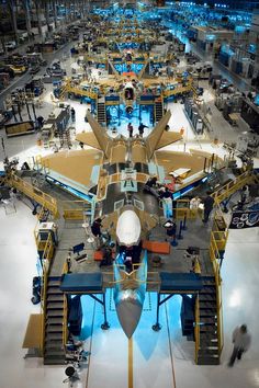 an airplane is being built in a factory