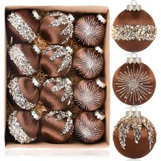 a box filled with brown and white christmas ornaments