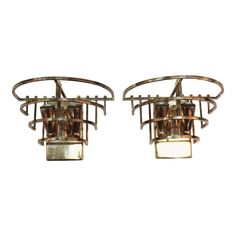 a pair of art deco style ceiling lights