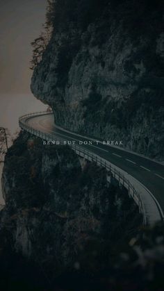 a road going down the side of a mountain with a quote on it that reads, friend but don't break