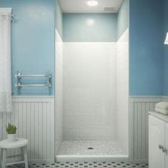 a bathroom with blue walls and white fixtures