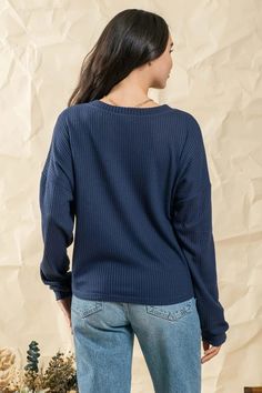 Waffle knit sweater top Front button detail Round neckline Long sleeves 95% Polyester/5% Spandex