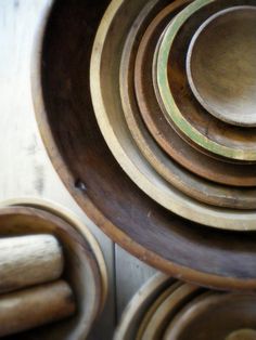 several wooden bowls stacked on top of each other