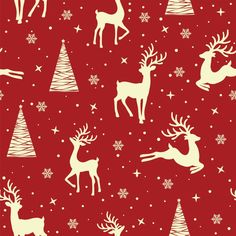 a red and white christmas pattern with reindeers