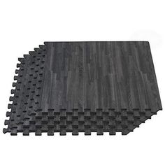 the floor mat is made out of black and gray wood planks, which are arranged in rows