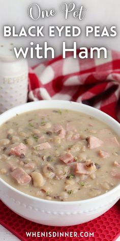 black eyed peas with ham in a white bowl on a red and white place mat